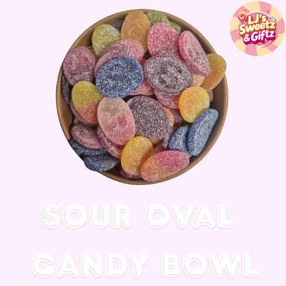 Sour oval candy bowl with colorful candies on a light pink background, branded 'LJ's Sweetz & Giftz'.