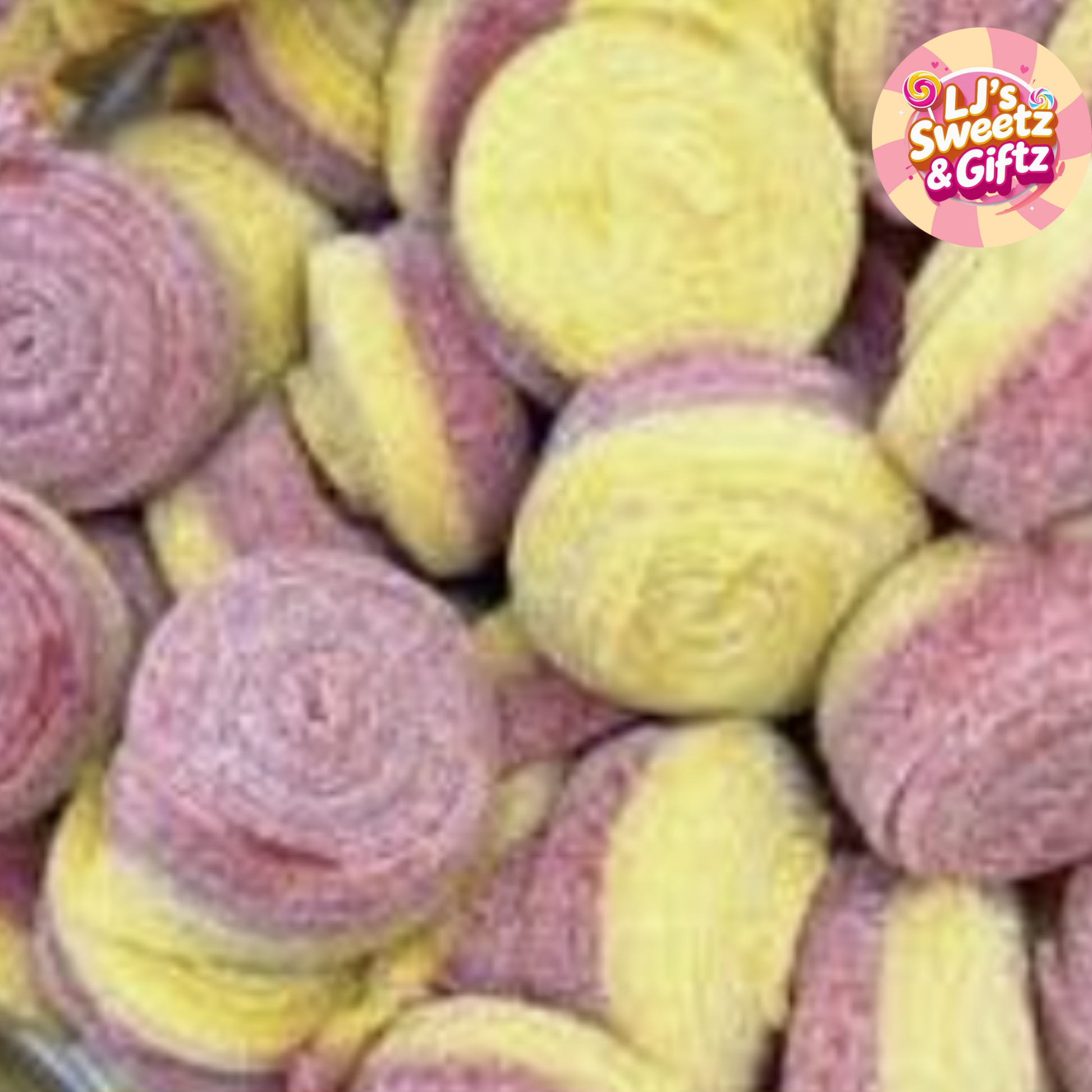 Close-up of pink and yellow candy rolls with 'LJ's Sweetz & Giftz' logo.